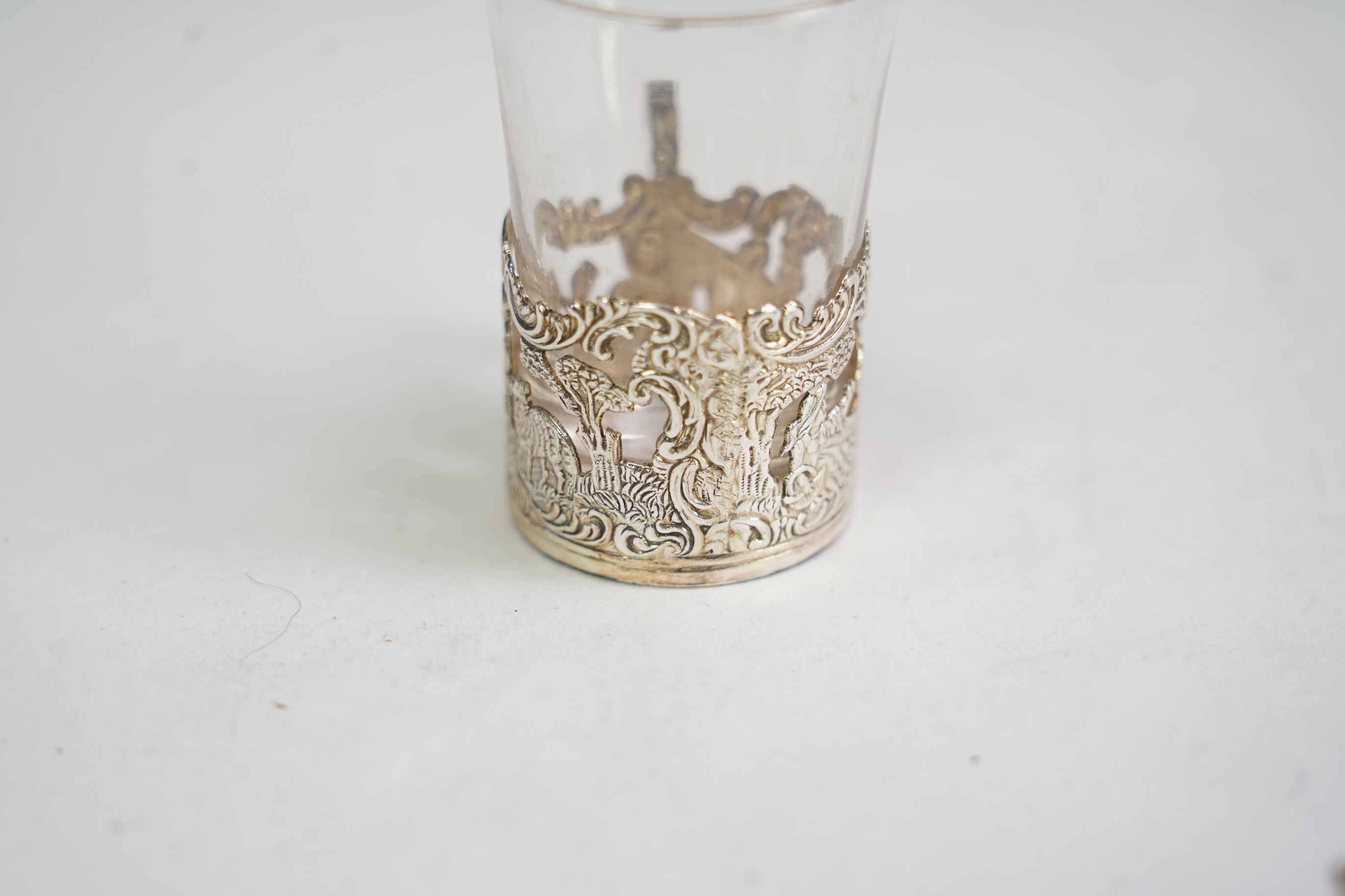 An Edwardian cased silver small two handled serving tray with six matching silver mounted glass liqueur tots, by Atkin Brothers